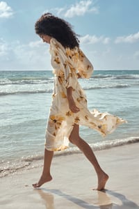 Weddingguest in floral dress at the beach