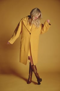 Woman wearing yellow coat