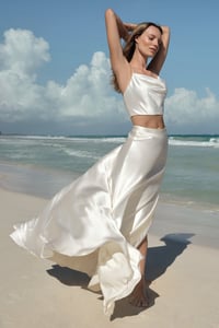 Bride in a two piece wedding dress at the beach