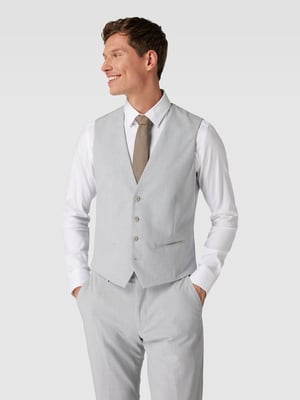 Grauer Anzug kombiniert mit einem weißem Hemd und einer gemusterten Krawatte 